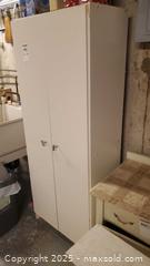 MaxSold Auction: White Laminate Freestanding Storage Cabinet / Utility Pantry C - Ottawa (Ontario, Canada) PARTNER MANAGED Downsizing Online Auction - Garfield Avenue