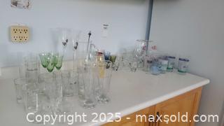 MaxSold Auction: Mixed glassware lot with Pitcher, Flutes, and Tumblers B - Ottawa (Ontario, Canada) PARTNER MANAGED Downsizing Online Auction - Garfield Avenue