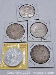MaxSold Auction: Four USA Morgan Silver Dollars and an Eisenhower Dollar - Burnside (British Columbia, Canada) PARTNER MANAGED Estate Sale Online Auction - Hillside Avenue