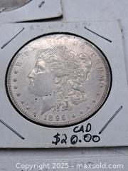 MaxSold Auction: Four USA Morgan Silver Dollars and an Eisenhower Dollar - Burnside (British Columbia, Canada) PARTNER MANAGED Estate Sale Online Auction - Hillside Avenue